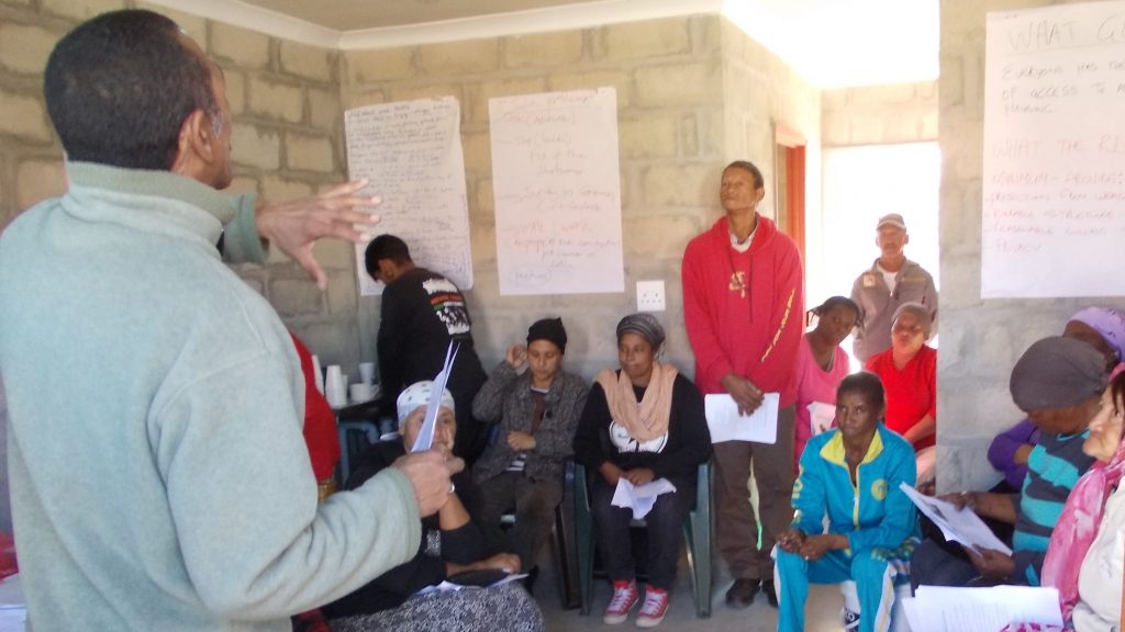 New home recipients meet to discuss the common problems they are facing with their recently obtained housing in Pelican Park, Cape Town. Credit: Zachary Levenson